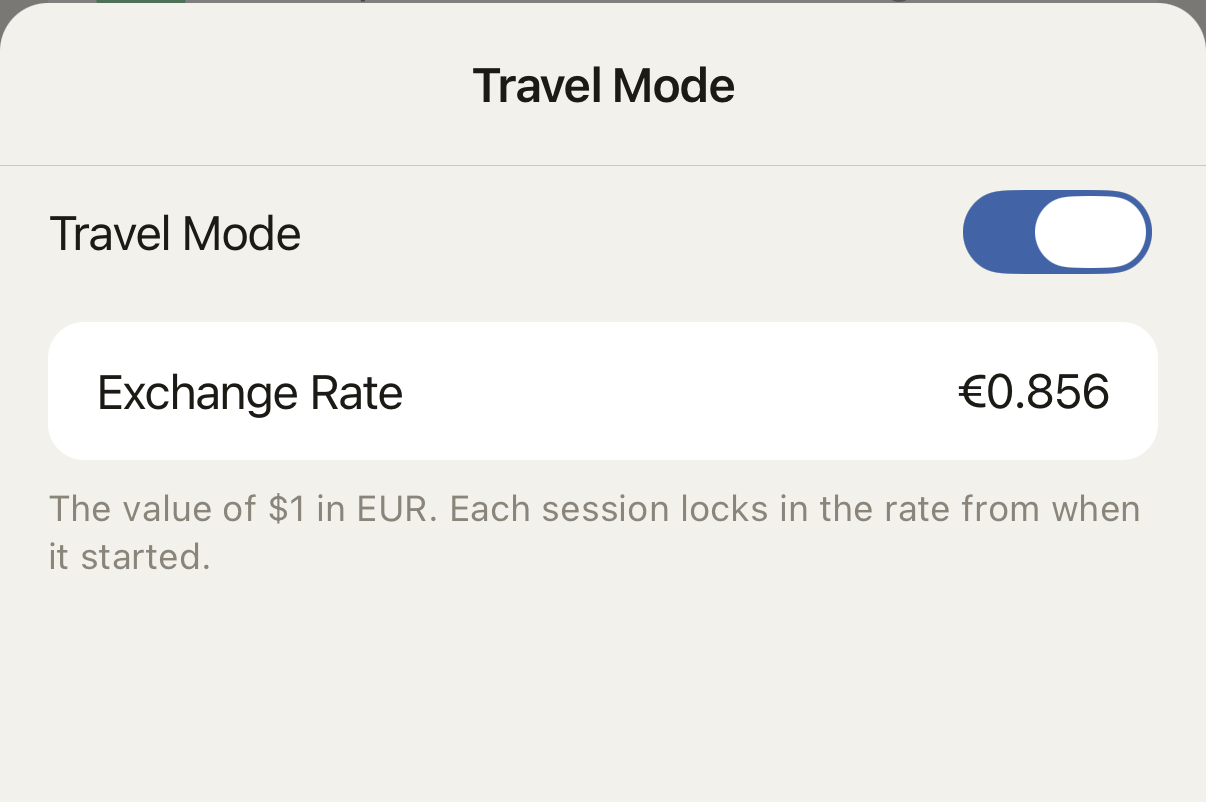 Travel Mode settings showing the exchange rate used for sessions.